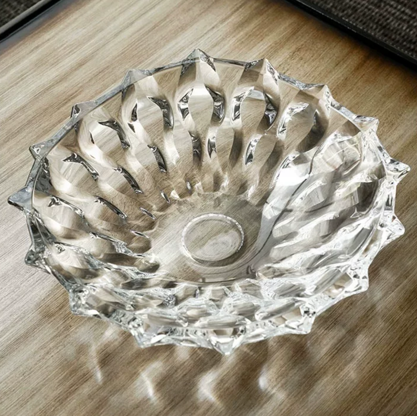 Top view of clear faceted glass fruit bowl showing geometric cut pattern and sparkling crystal finish