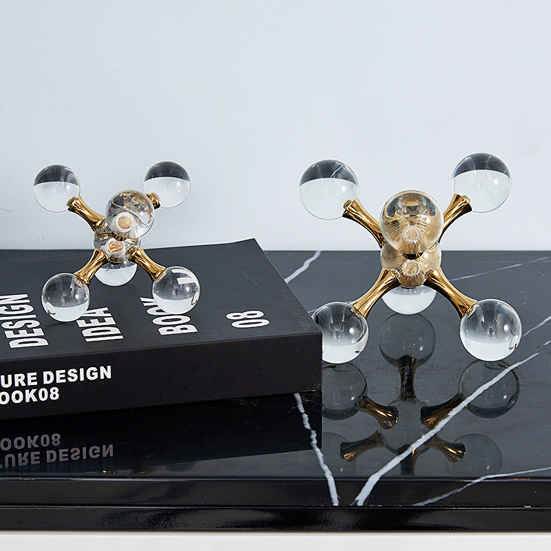 Large and medium crystal jack sculptures displayed together