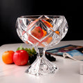 Clear crystal pedestal fruit bowl filled with fresh fruit