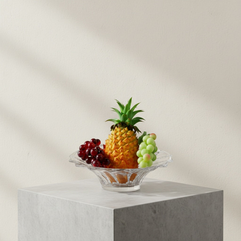 Crystal glass fruit bowl with scalloped rim filled with fruit