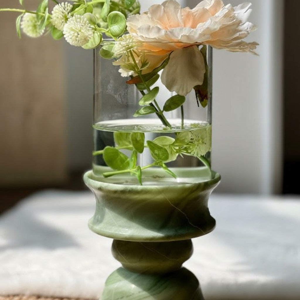 Clear glass cylinder vase with green stone pedestal base