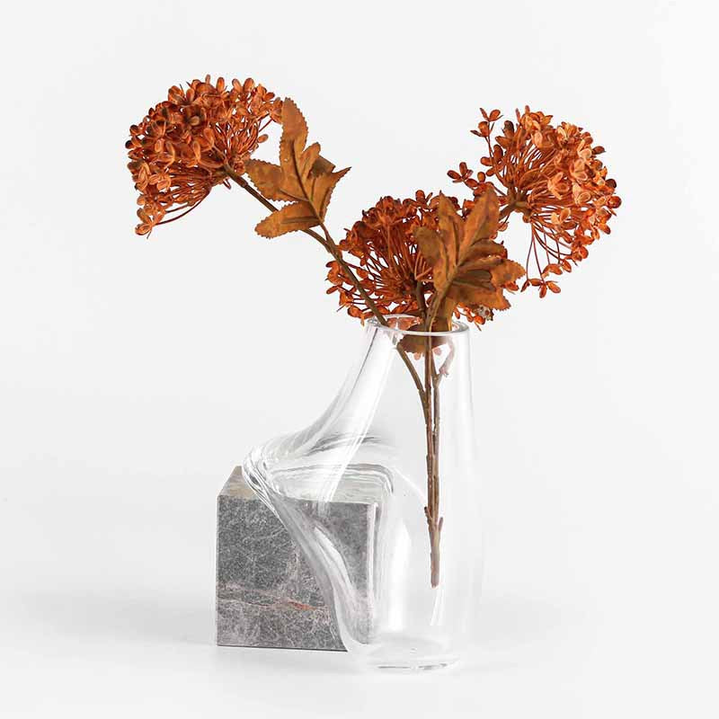 Front view of sculptural glass and marble vase