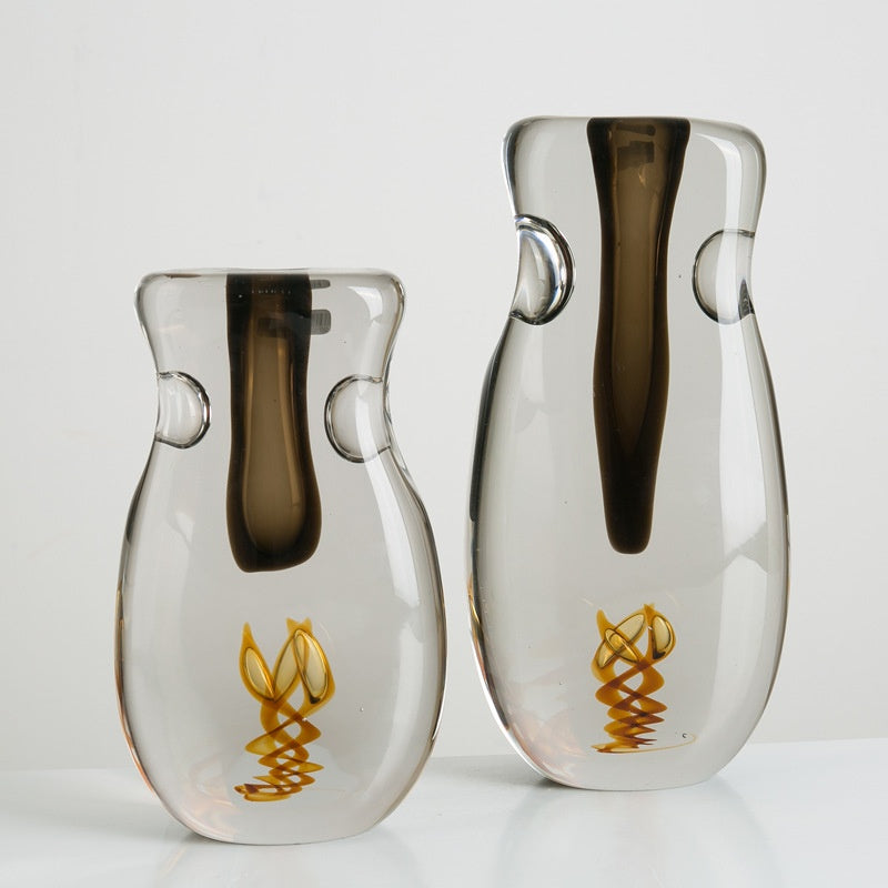Two sculptural glass vases with smoked and amber details