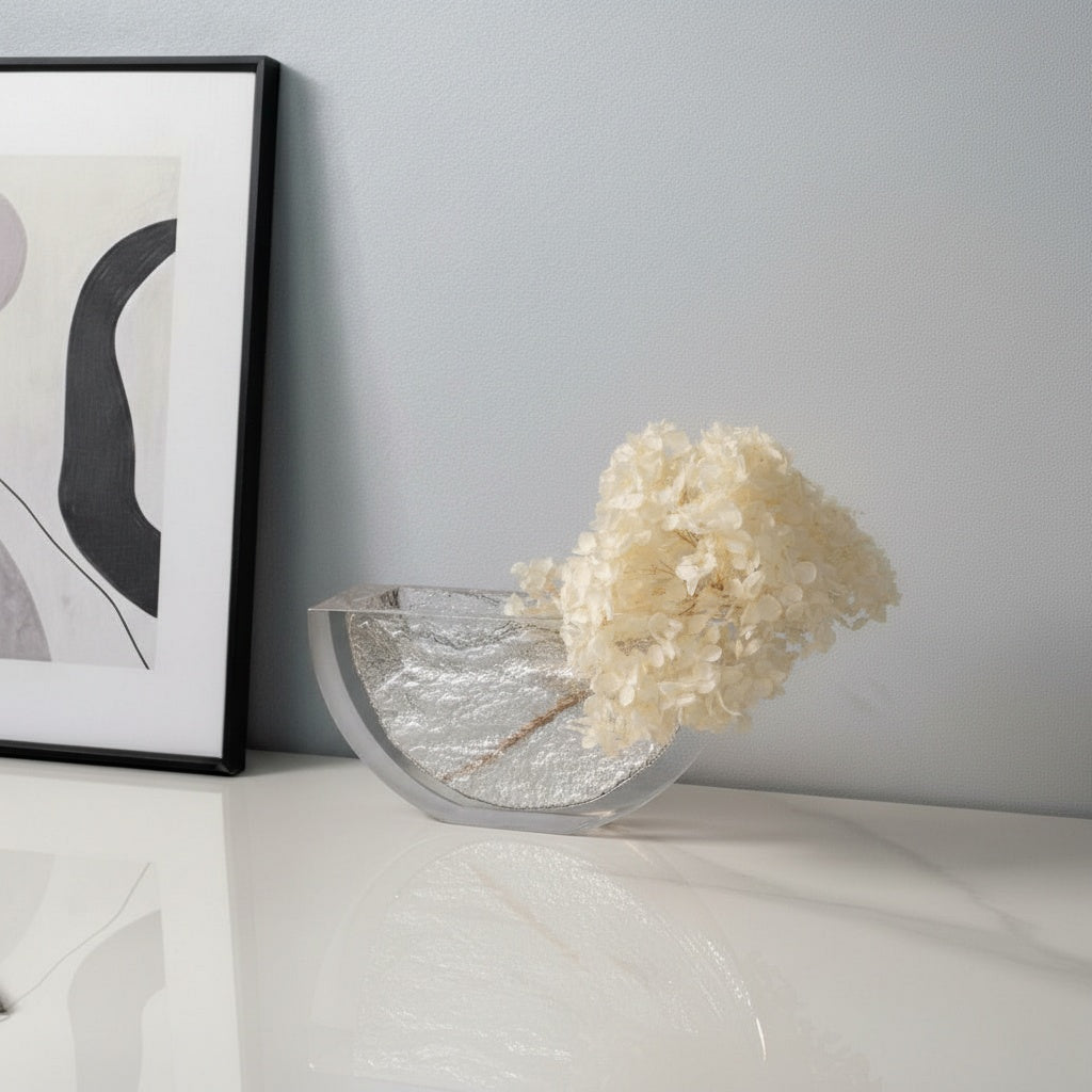 Clear textured glass half-moon vase with white flowers