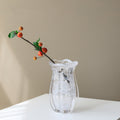 Full view of white swirl glass vase with branch