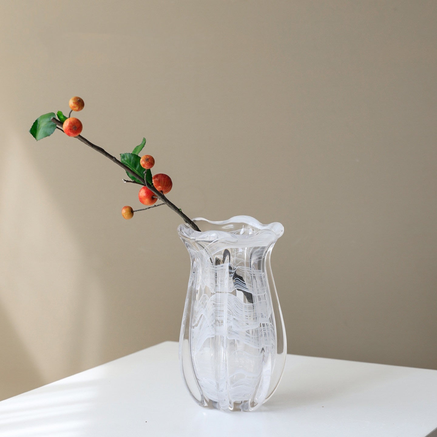 Full view of white swirl glass vase with branch