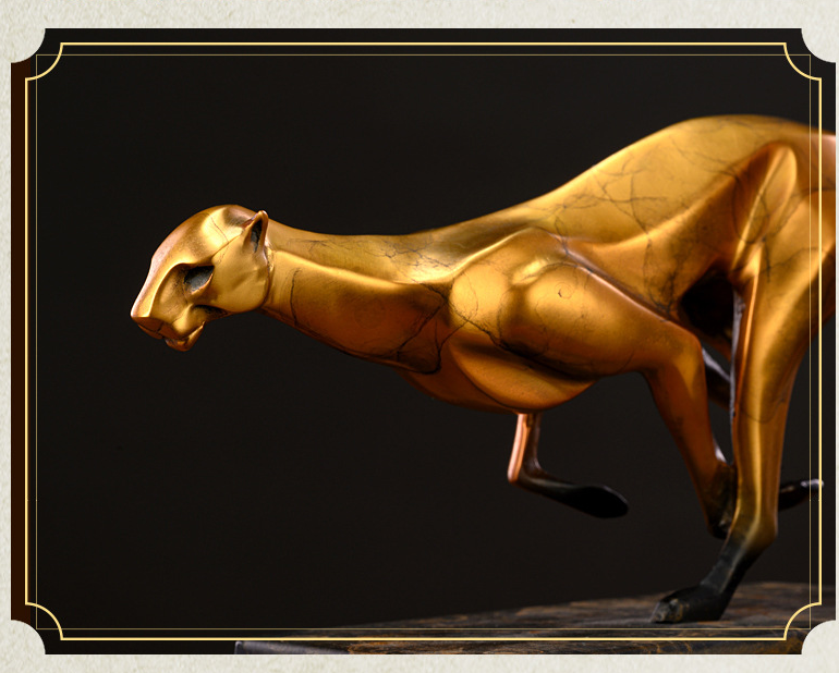 Close up detail of gold textured finish on copper cheetah head