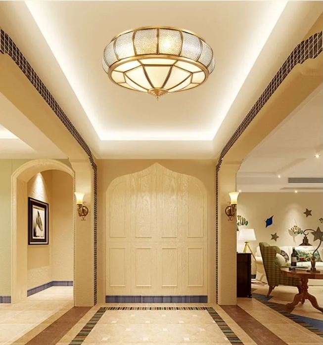 Copper flush mount light installed in a luxury hallway