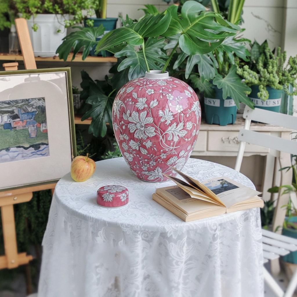 Coral floral ceramic ginger jar used as a vase with greenery
