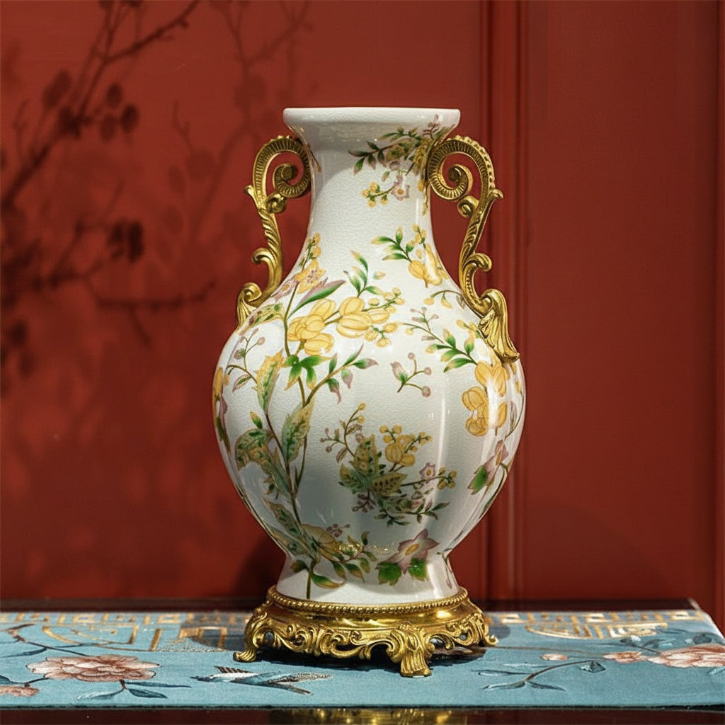 Front view of the ceramic floral vase with brass handles