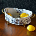 Porcelain bowl with lemons on wood table
