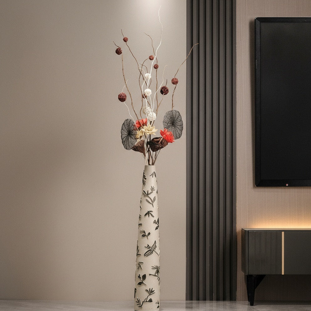 Cream ceramic floor vase with black botanical pattern in living room setting