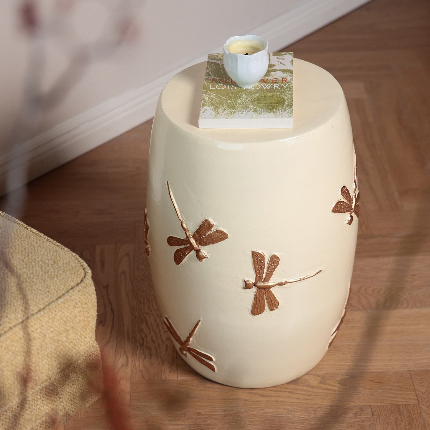 High angle view of ceramic dragonfly stool with decor