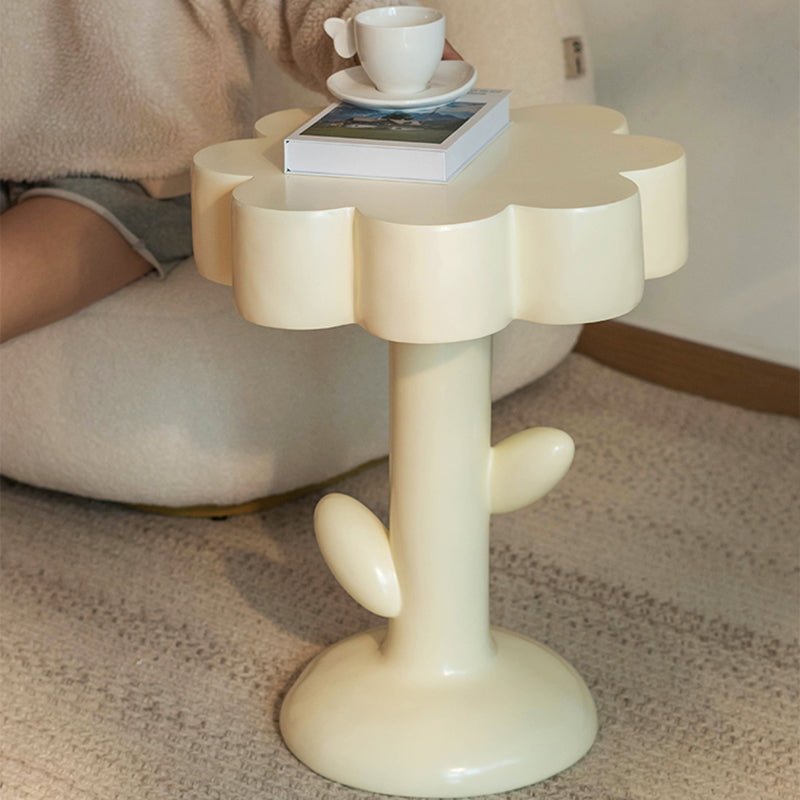 Full view of cream pedestal table with leaf details
