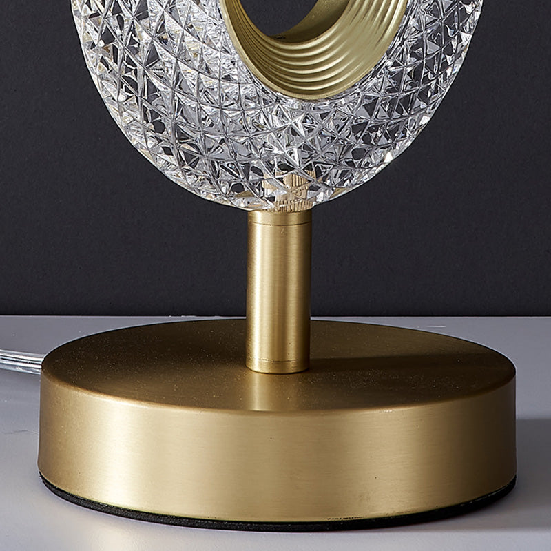 Detail view of brushed brass finish base and stem