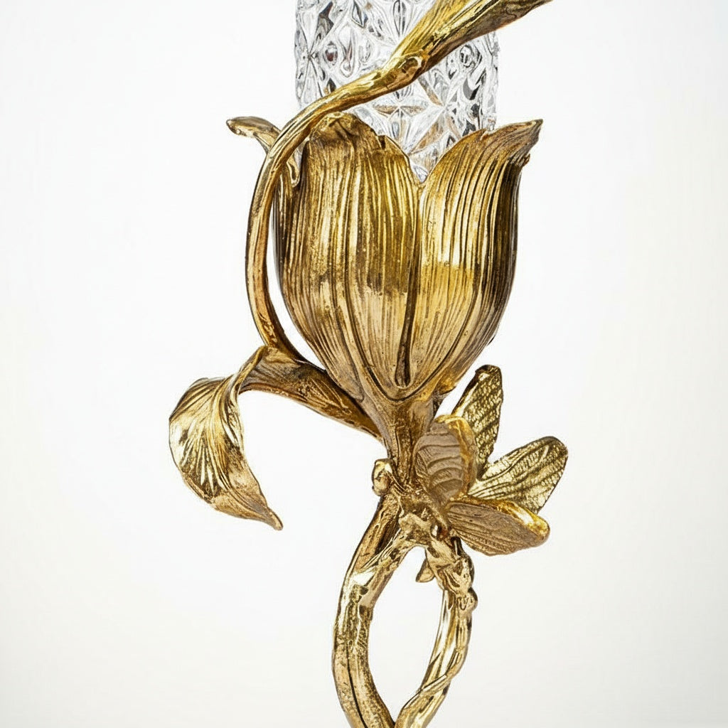 Detail shot of gold finished brass flower base and butterfly