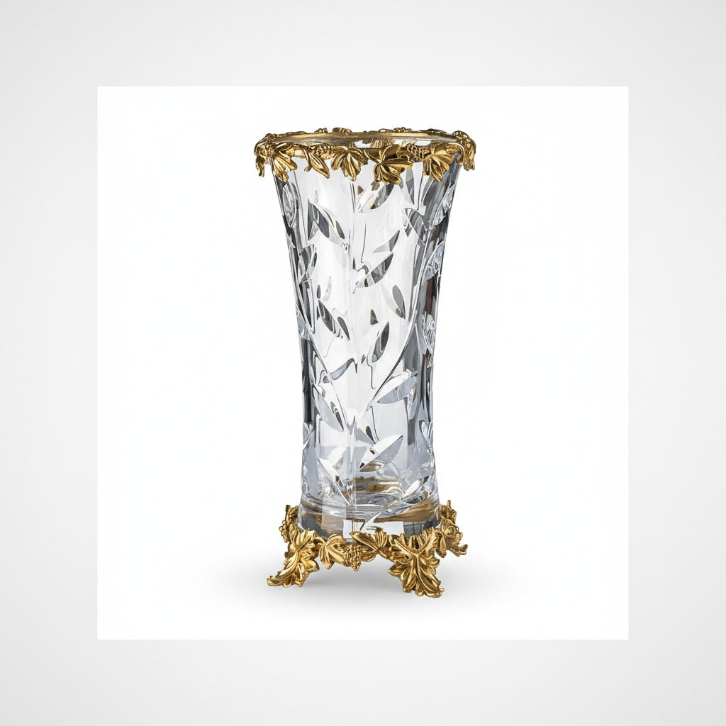 Full view of empty cut crystal vase with ornate gold metal base