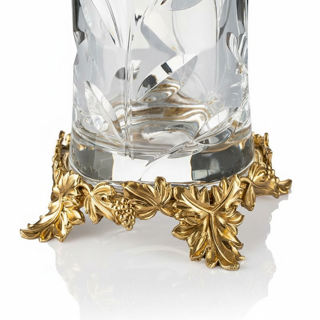 Close up detail of gold-finish brass grapevine base and cut glass texture