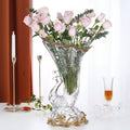 Front view of crystal peacock cornucopia vase with roses