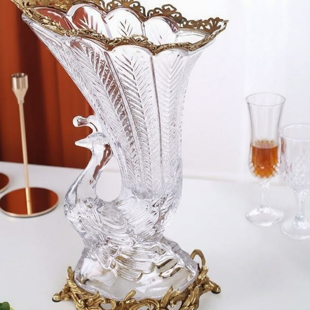 Side view of empty crystal and brass peacock vase showing etching details
