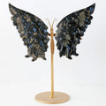 Dark blue and black stone butterfly sculpture on gold stand