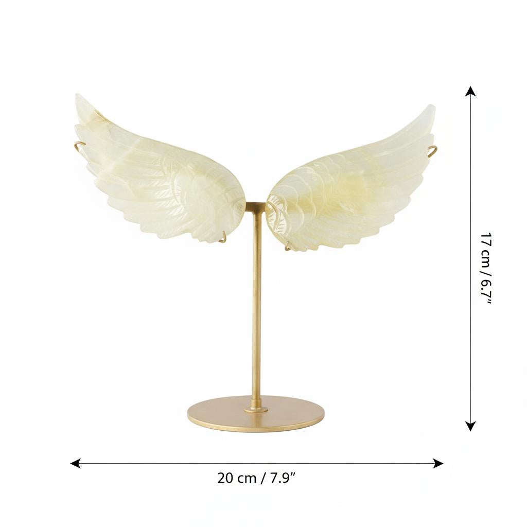 Carved crystal angel wings sculpture on gold stand