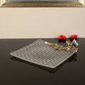 Front view of woven crystal tray with enamel butterfly detail