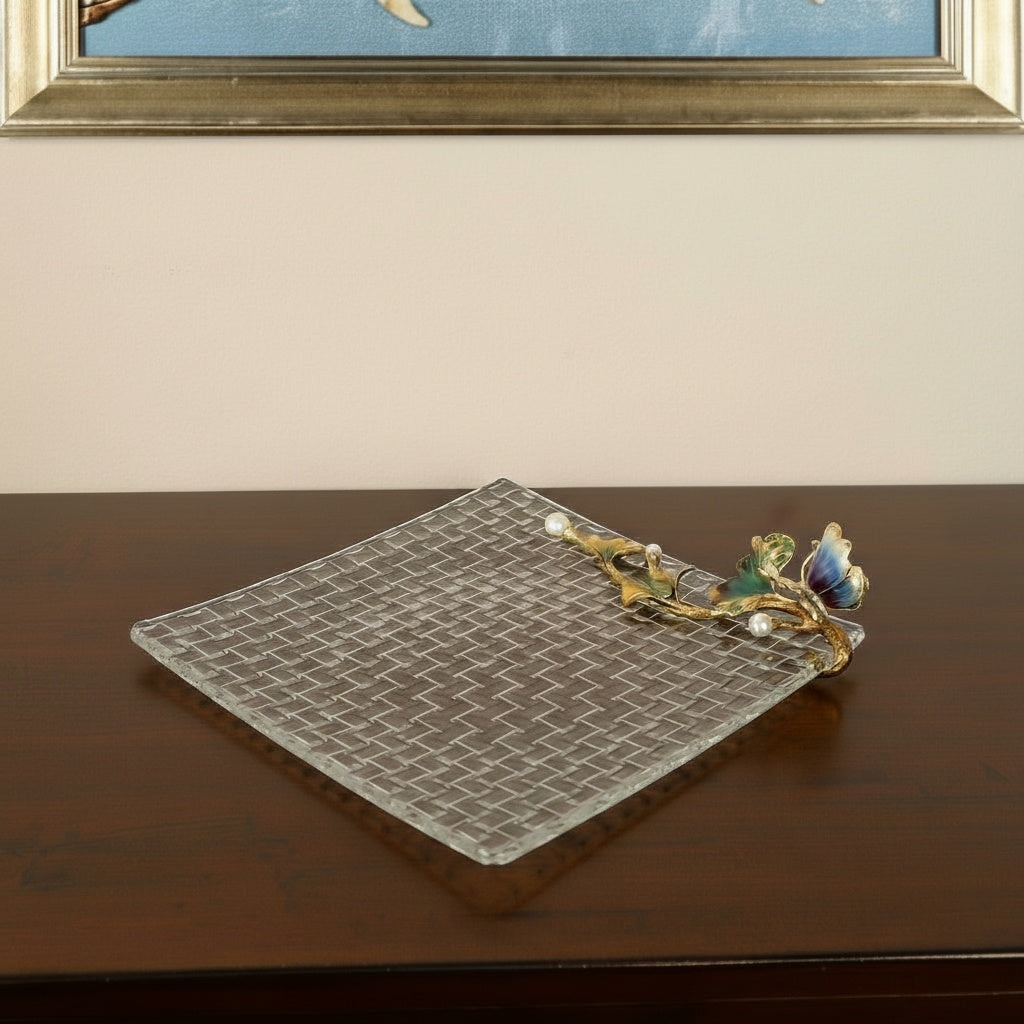 Perspective view of square crystal tray showing woven texture and gold accents