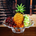 Crystal glass scalloped fruit bowl filled with fruit