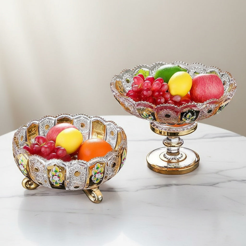 Luxury glass fruit bowl set with gold and floral details on marble table