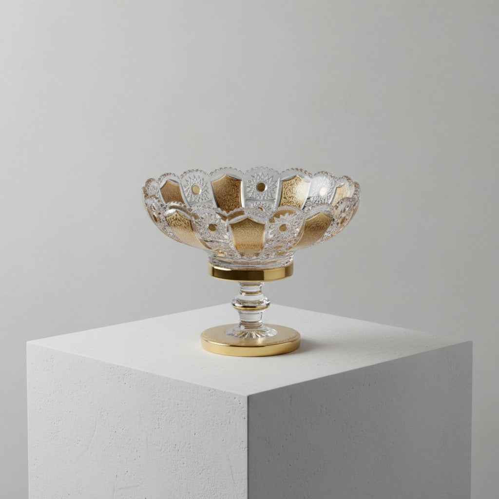 Detailed view of gold and crystal cut patterns on footed bowl