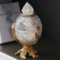 Front view of crystal orb tissue dispenser on gold floral stand