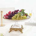 Front view of crystal and gold fruit stand with grapes