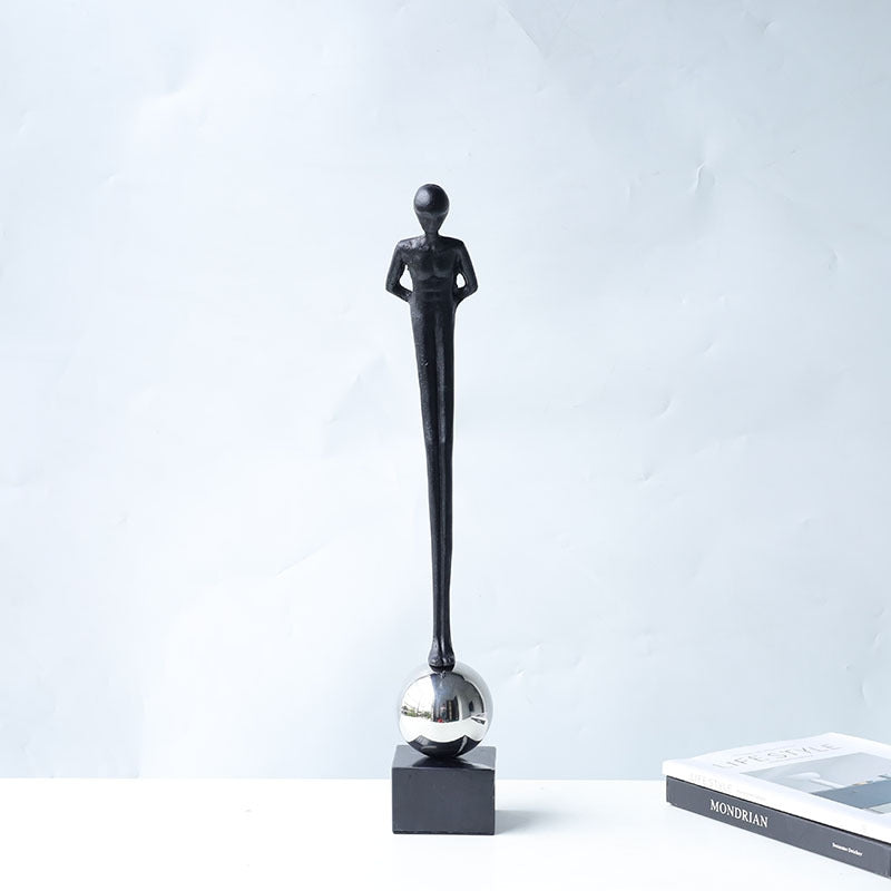 Back view of standing figure sculpture