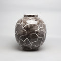 Dark brown and white abstract glazed ceramic sphere vase front view