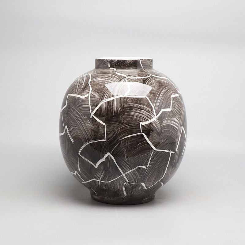 Dark brown and white abstract glazed ceramic sphere vase front view