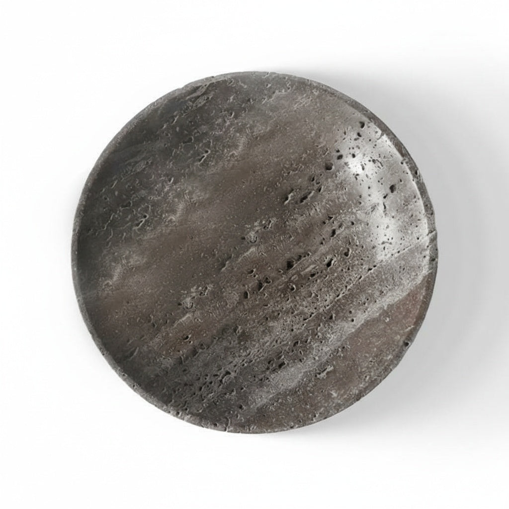 Top view of round travertine decorative dish