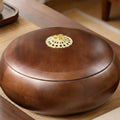 Angled view of closed walnut snack box with brass handle