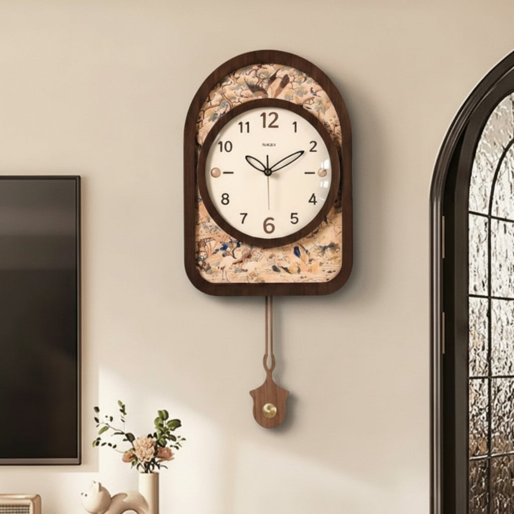 Front view of dark wood arched wall clock with pendulum on wall