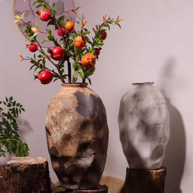 Distressed ceramic organic vase with red botanicals