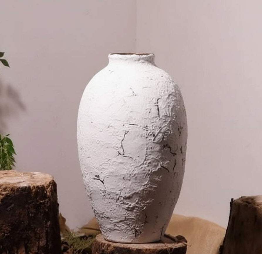 White distressed ceramic vase detail