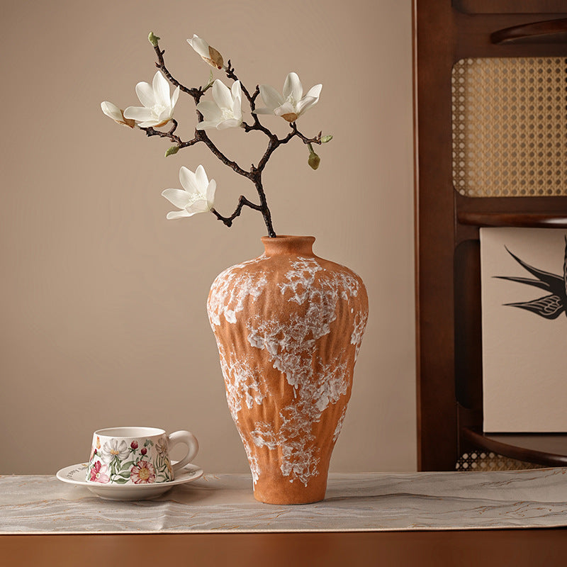 Detail of weathered ceramic texture on terracotta vase surface