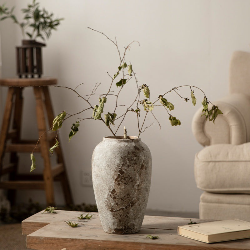 Rustic ceramic vase with bare branches