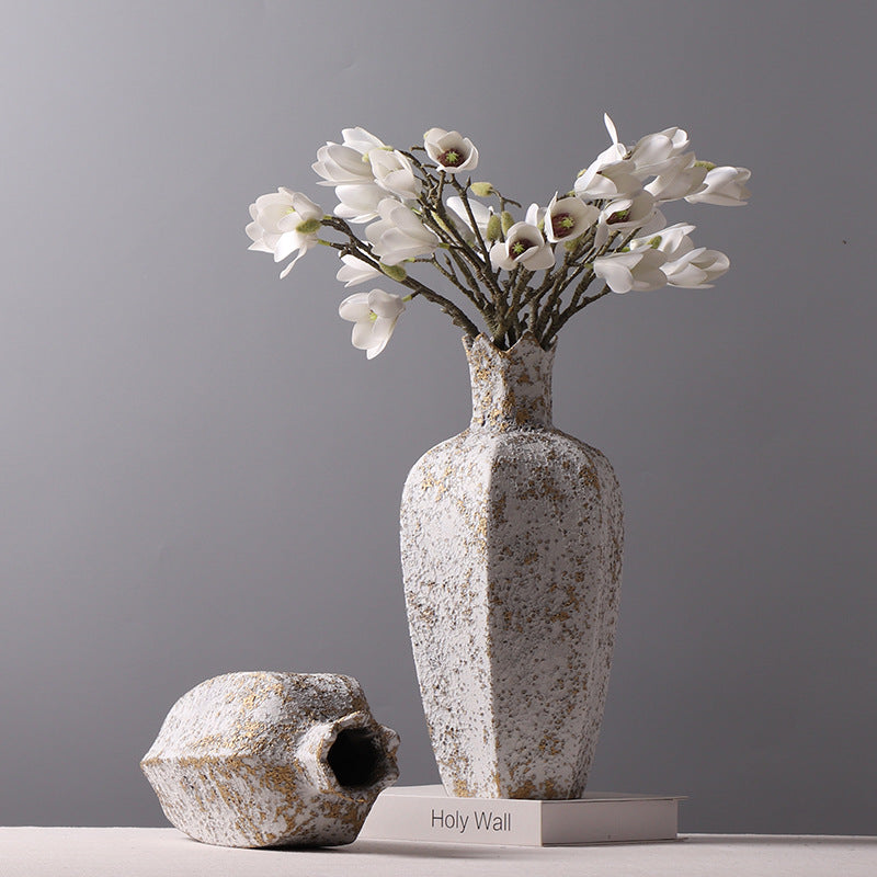 Large textured white and gold vase with crown rim and white flowers