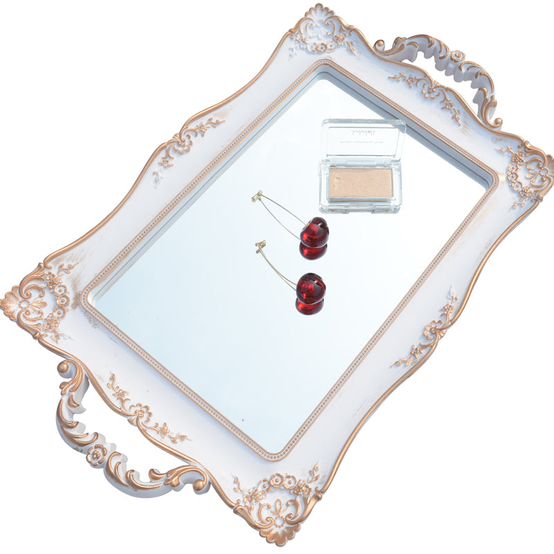 Angled view of white french country style mirror tray on a white background