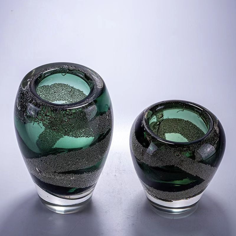 Top view of two green glass vases showing rim thickness