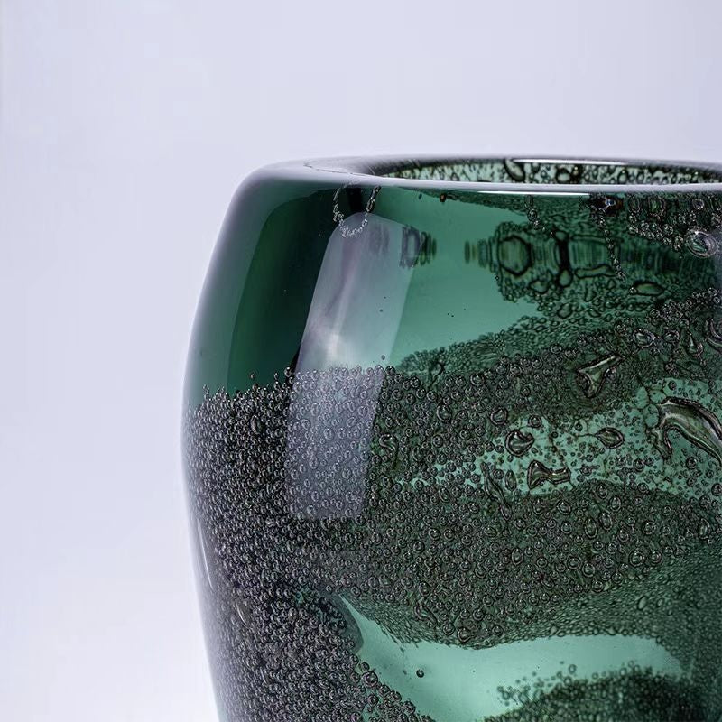 Close up of bubble texture in green glass