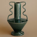 Front view of emerald green ceramic vase with wavy handles