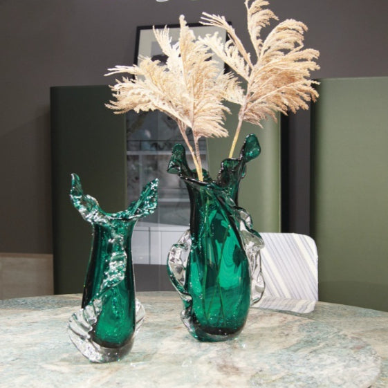 Group shot of emerald green freeform glass vases