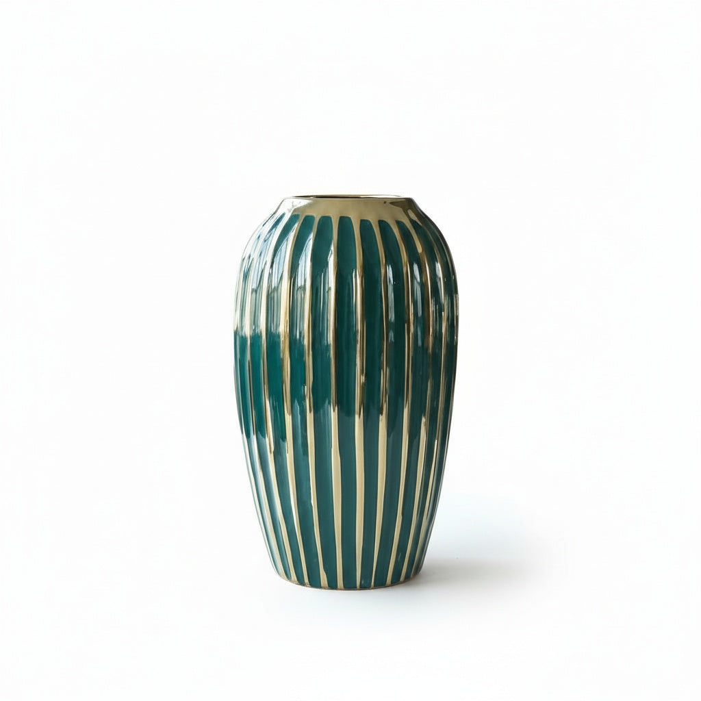 Emerald green ceramic vase with gold stripes on white background